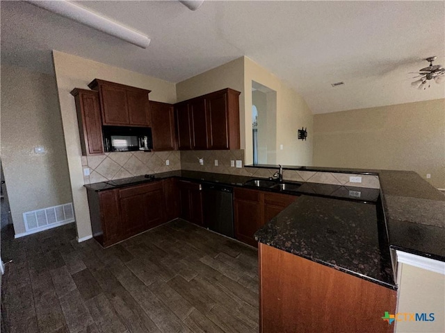 kitchen featuring sink, dark wood-type flooring, backsplash, black appliances, and kitchen peninsula