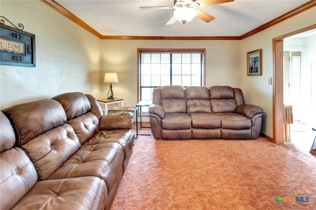 carpeted living room with crown molding, a textured ceiling, and ceiling fan