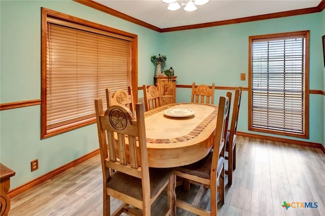 3662 N Fm 444, Inez, TX 77968 - dining area featuring ornamental molding, baseboards, light wood finished floors, and a chandelier