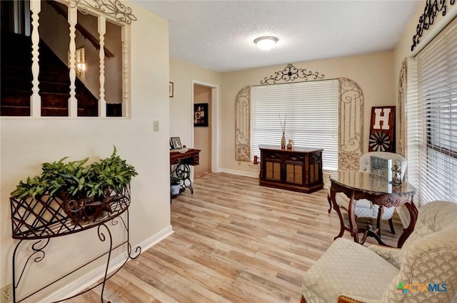 3662 N Fm 444, Inez, TX 77968 - dining space featuring light wood-style flooring, baseboards, and a textured ceiling