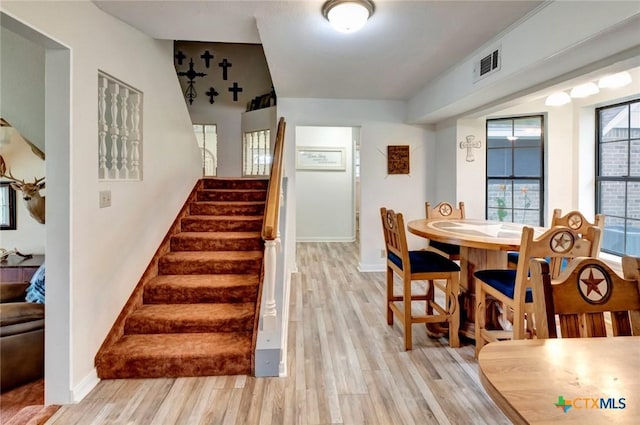 3662 N Fm 444, Inez, TX 77968 - dining room featuring stairs, light wood finished floors, and baseboards