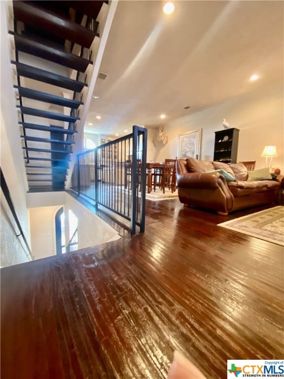 stairway featuring wood-type flooring