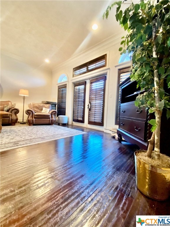 interior space with dark wood-type flooring and crown molding