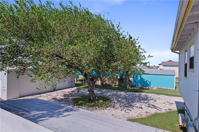 exterior space with a garage and a front yard