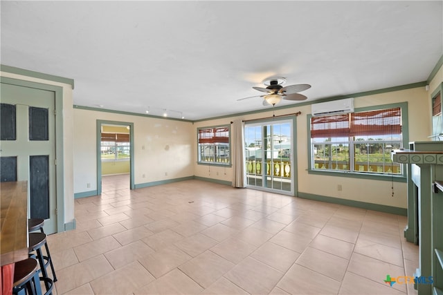 unfurnished living room featuring a wall unit AC, ceiling fan, and light tile patterned flooring