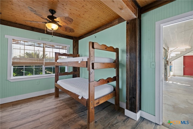 unfurnished bedroom featuring hardwood / wood-style flooring, ceiling fan, and wooden ceiling