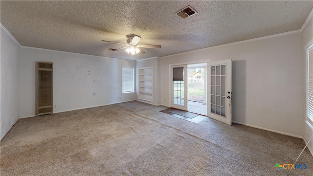 4610 Camellia St, Victoria, TX 77904 - empty room with a heating unit, crown molding, carpet flooring, ceiling fan, and a textured ceiling