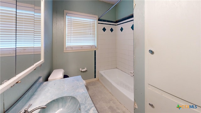 4610 Camellia St, Victoria, TX 77904 - bathroom with shower / washtub combination, healthy amount of natural light, vanity, and tile patterned flooring