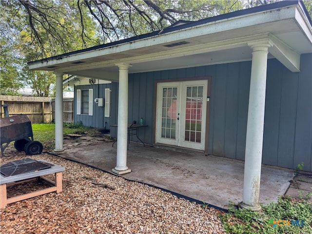 4610 Camellia St, Victoria, TX 77904 - rear view of house featuring french doors, a patio, and board and batten siding