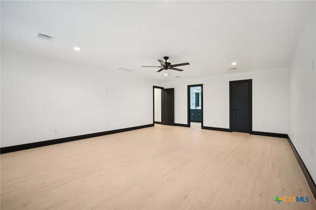 empty room featuring ceiling fan and light wood-type flooring