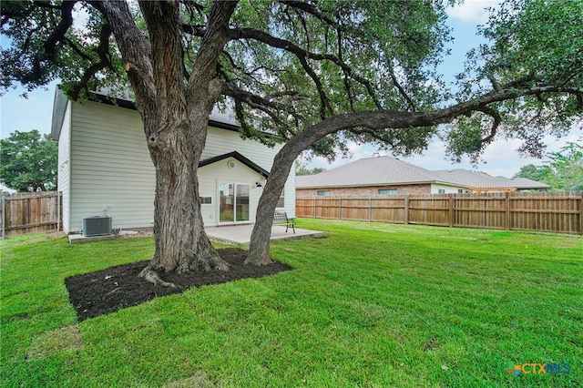 view of yard featuring central AC unit and a patio area