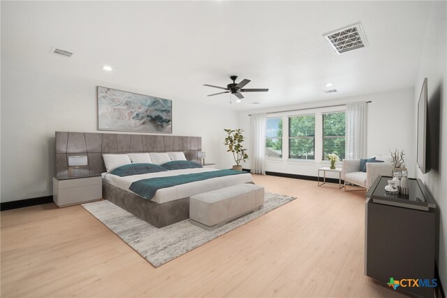 bedroom featuring light hardwood / wood-style flooring and ceiling fan