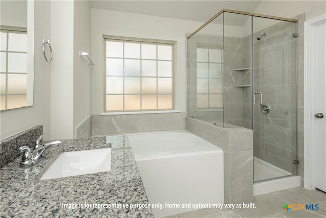 bathroom with independent shower and bath, a wealth of natural light, sink, and tile patterned floors