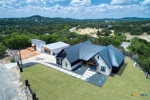 drone / aerial view featuring a mountain view