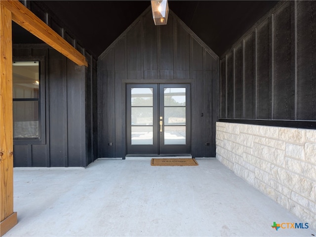 view of exterior entry featuring french doors
