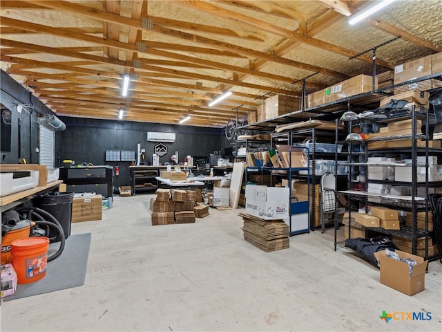 storage room with a wall mounted air conditioner