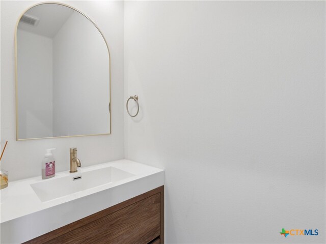 bathroom featuring vanity and visible vents
