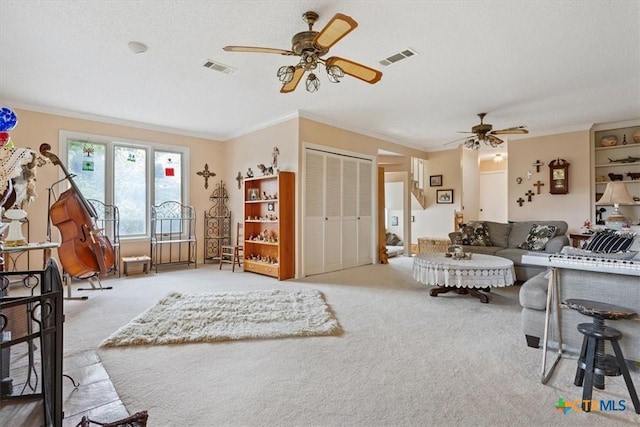 910 Mill Creek Dr, Salado, TX 76571 - living area featuring ceiling fan, carpet floors, and crown molding