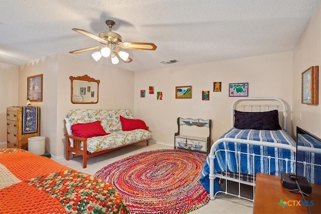 910 Mill Creek Dr, Salado, TX 76571 - carpeted bedroom featuring a textured ceiling and ceiling fan