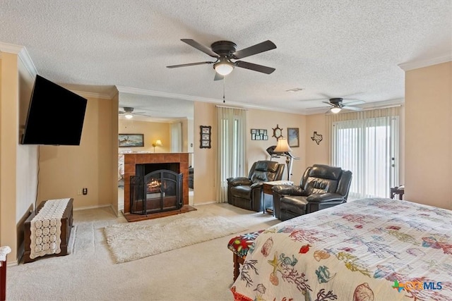 910 Mill Creek Dr, Salado, TX 76571 - carpeted bedroom with crown molding, a textured ceiling, a fireplace, and a ceiling fan