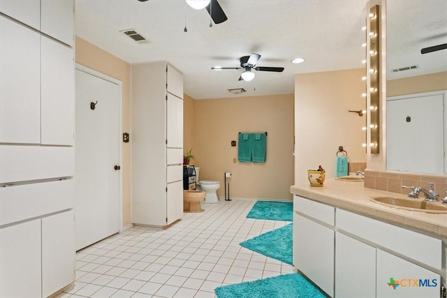 910 Mill Creek Dr, Salado, TX 76571 - bathroom featuring a ceiling fan, vanity, a bidet, recessed lighting, and tile patterned floors