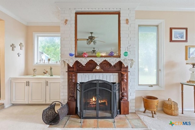 910 Mill Creek Dr, Salado, TX 76571 - living area featuring ornamental molding, a brick fireplace, ceiling fan, and light colored carpet