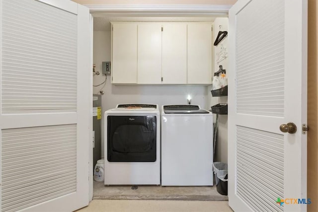 910 Mill Creek Dr, Salado, TX 76571 - laundry area with washing machine and dryer and cabinet space