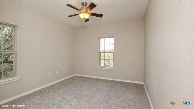 1974 Canyon Bnd, Canyon Lake, TX 78133 - unfurnished room featuring plenty of natural light, carpet flooring, and baseboards