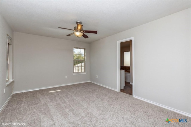 1974 Canyon Bnd, Canyon Lake, TX 78133 - unfurnished room with a ceiling fan, carpet floors, and baseboards