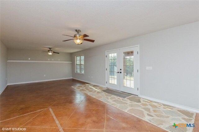 1974 Canyon Bnd, Canyon Lake, TX 78133 - empty room featuring french doors, a ceiling fan, baseboards, and tile patterned flooring