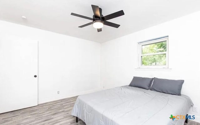 902 Concord Dr, Temple, TX 76504 - bedroom with wood finished floors and ceiling fan