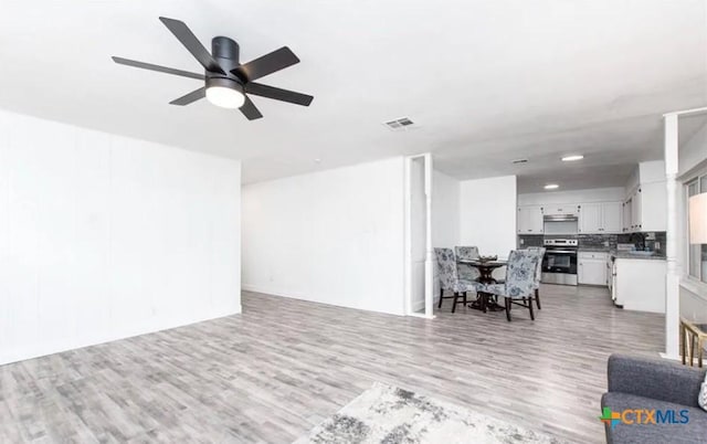 902 Concord Dr, Temple, TX 76504 - living area with light wood finished floors and ceiling fan