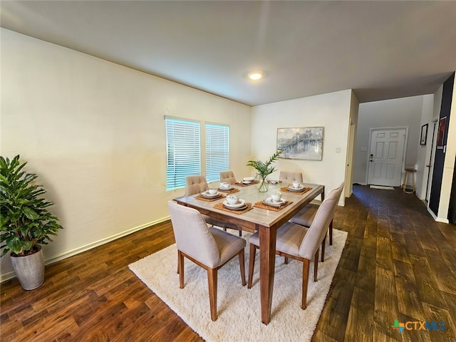 dining space with dark wood-type flooring