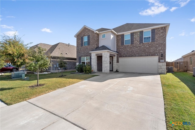 view of front property featuring central air condition unit, a garage, and a front yard