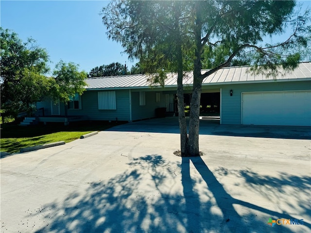 single story home with a garage and a front yard