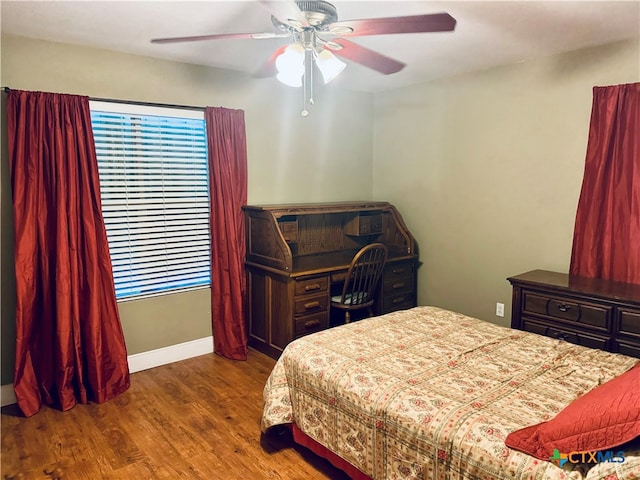 bedroom with wood-type flooring and ceiling fan