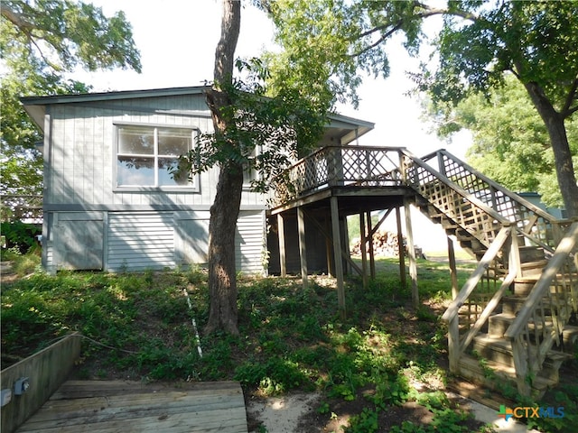 view of home's exterior featuring a deck