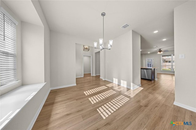 1821 Holleman Dr, Temple, TX 76502 - unfurnished dining area featuring a chandelier, wood finished floors, recessed lighting, and ceiling fan