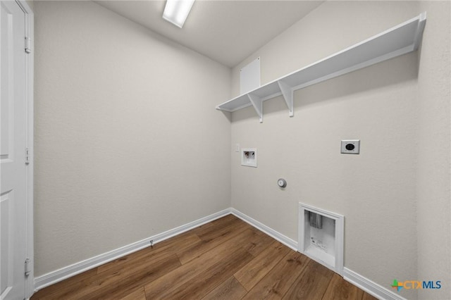 1821 Holleman Dr, Temple, TX 76502 - laundry room with dark wood-style floors, washer hookup, electric dryer hookup, and gas dryer hookup