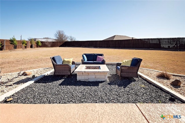 view of yard with a patio area, a fire pit, and a fenced backyard