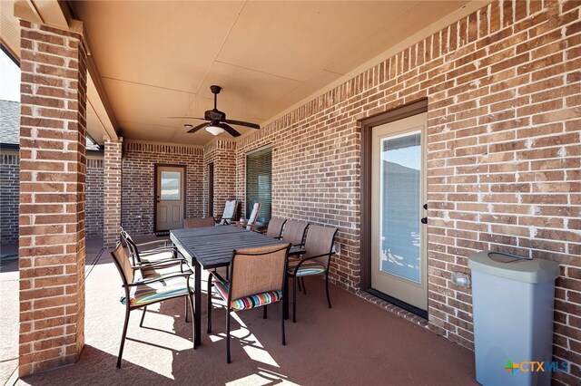 view of patio featuring outdoor dining area and ceiling fan