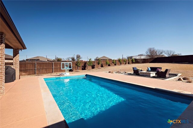 view of pool featuring a fenced in pool, a patio, and a fenced backyard