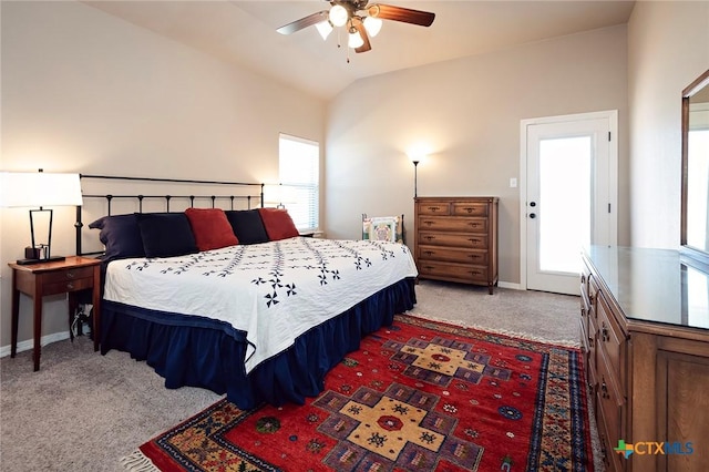 carpeted bedroom with lofted ceiling, baseboards, and ceiling fan