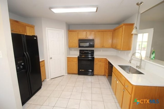 1213 Marlee Cir, Copperas Cove, TX 76522 - kitchen featuring black appliances, a sink, light countertops, and light tile patterned floors