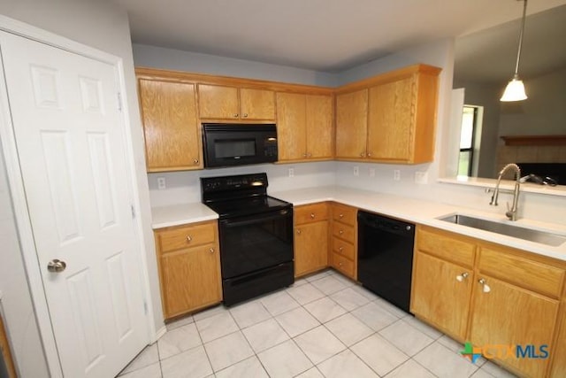 1213 Marlee Cir, Copperas Cove, TX 76522 - kitchen with black appliances, a sink, light countertops, light tile patterned flooring, and decorative light fixtures