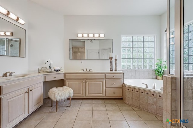 bathroom featuring plenty of natural light, tile patterned floors, and two vanities