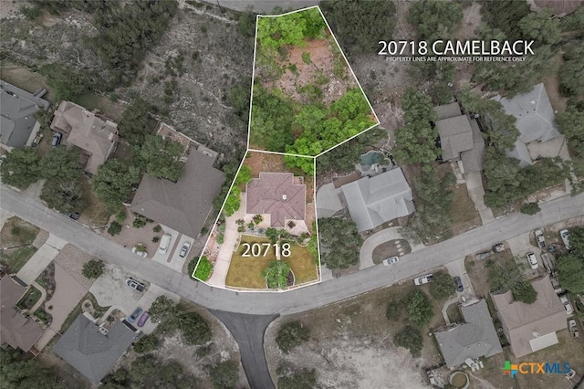 aerial view of residential area with property boundaries highlighted