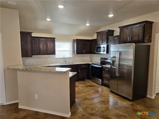 1421 Fossil Trl, Belton, TX 76513 - kitchen with stainless steel appliances, dark brown cabinets, decorative backsplash, a sink, and a peninsula