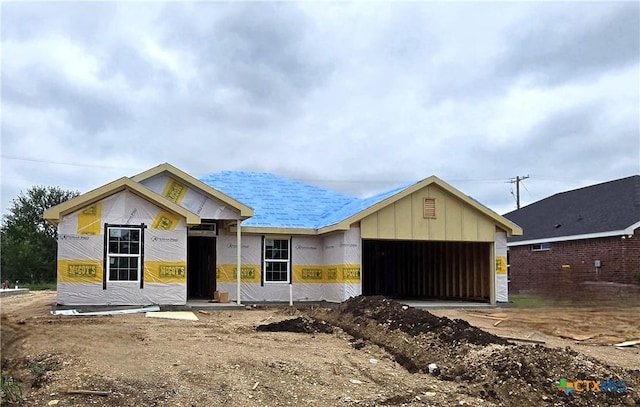 1421 Fossil Trl, Belton, TX 76513 - property under construction with an attached garage, board and batten siding, and driveway
