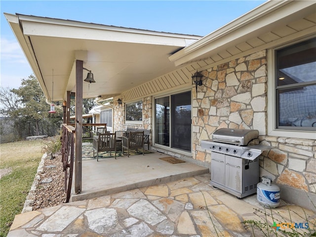 view of patio featuring a grill